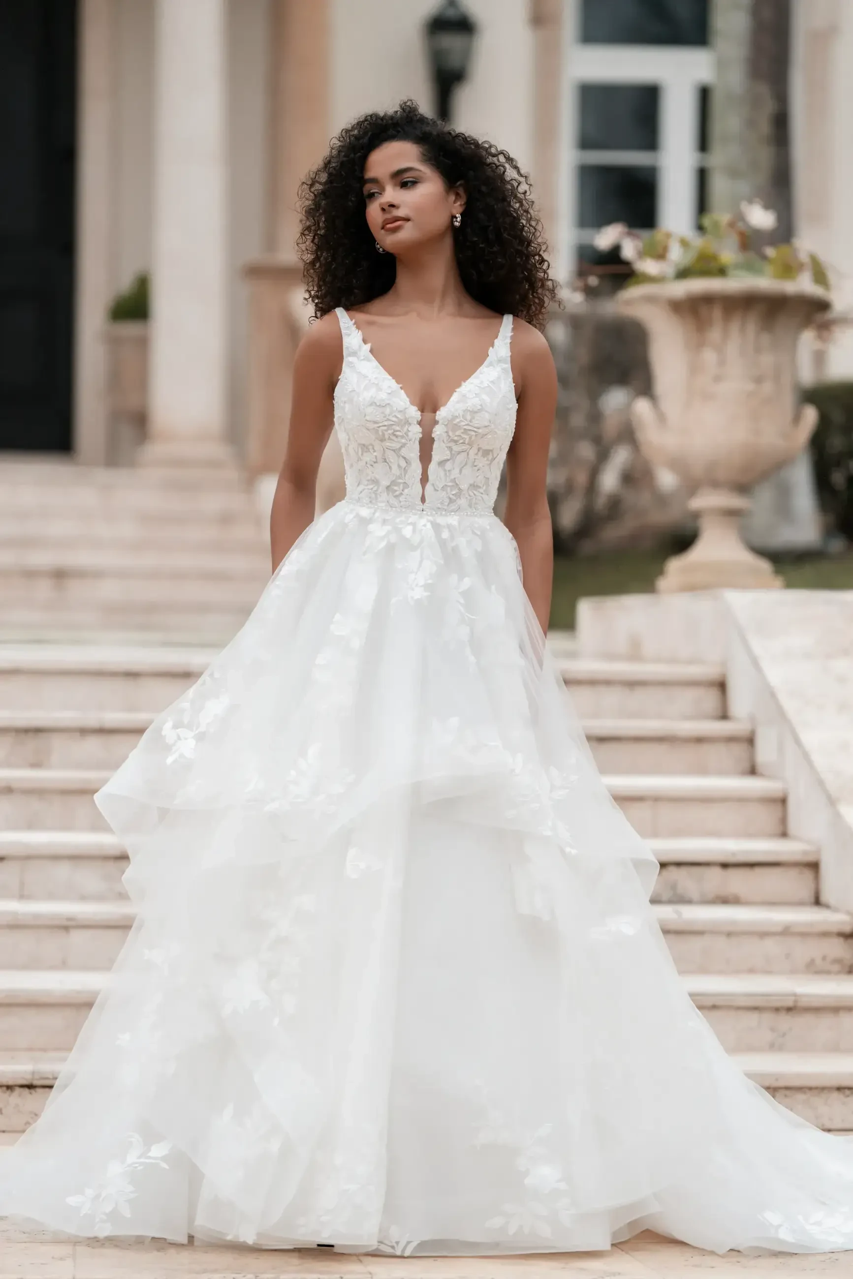 Model wearing a gown by Allure Bridals