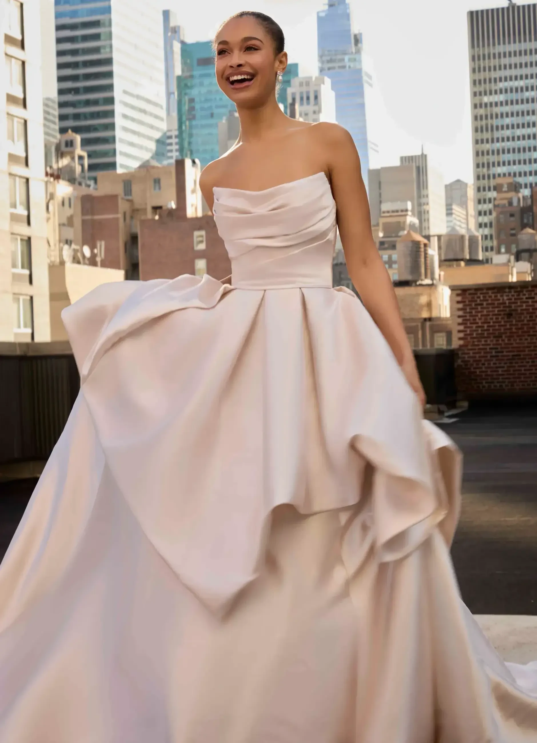 Model wearing a gown by Madison James