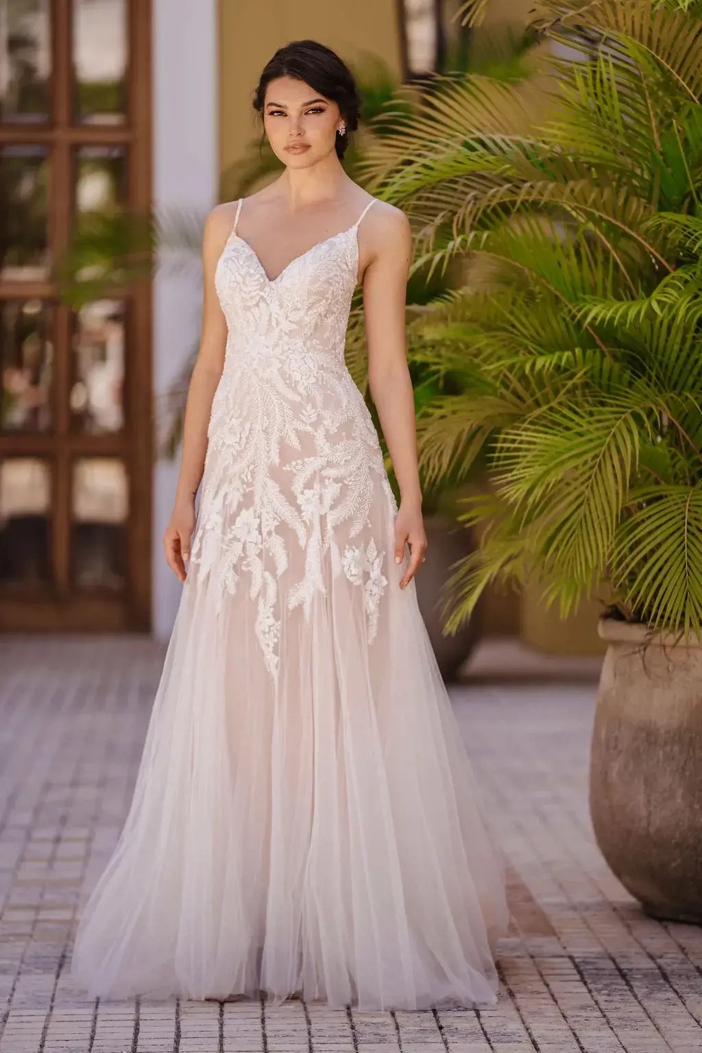 Model wearing a gown by Allure Bridals