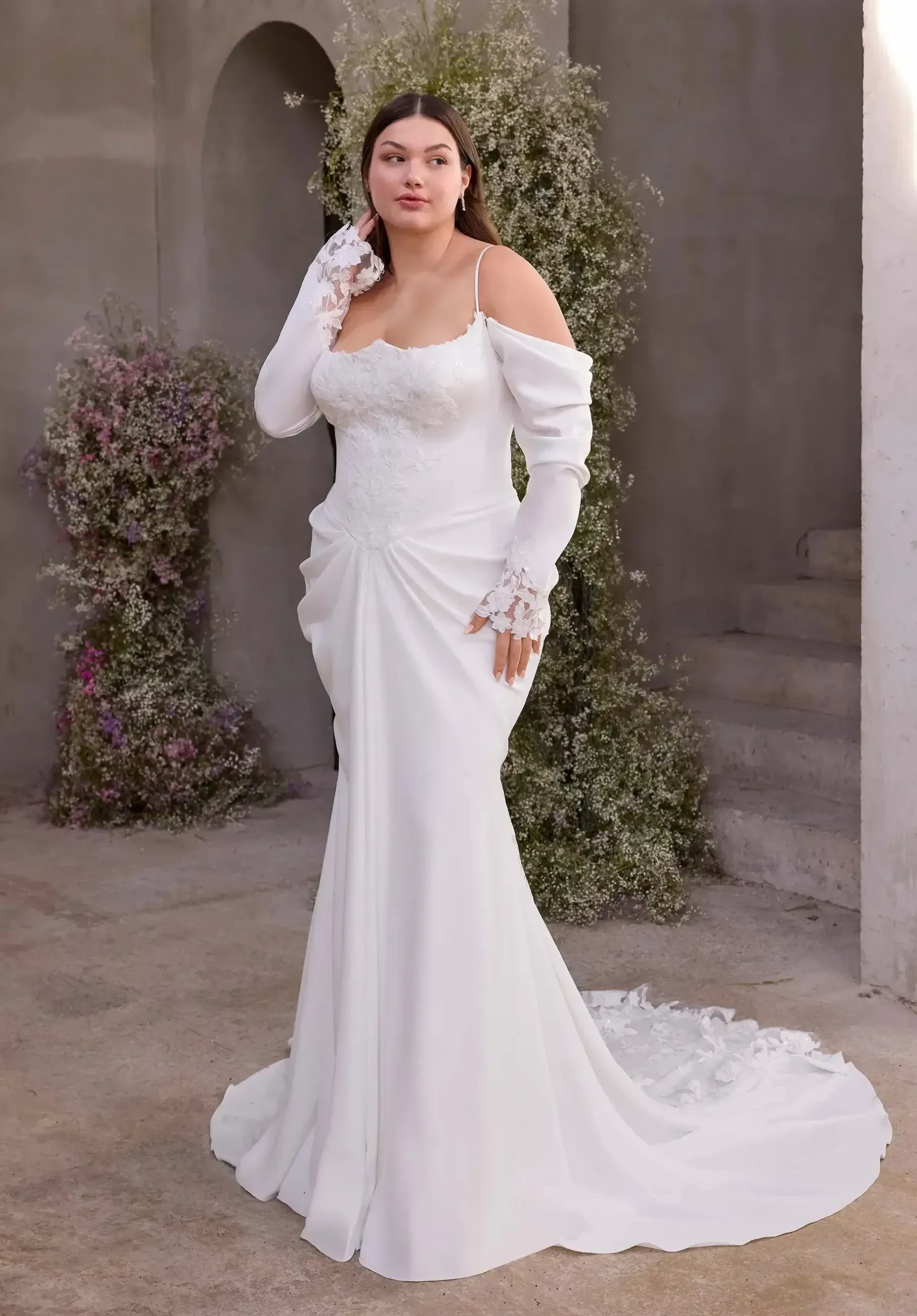 Model wearing a gown by Julietta By Morilee