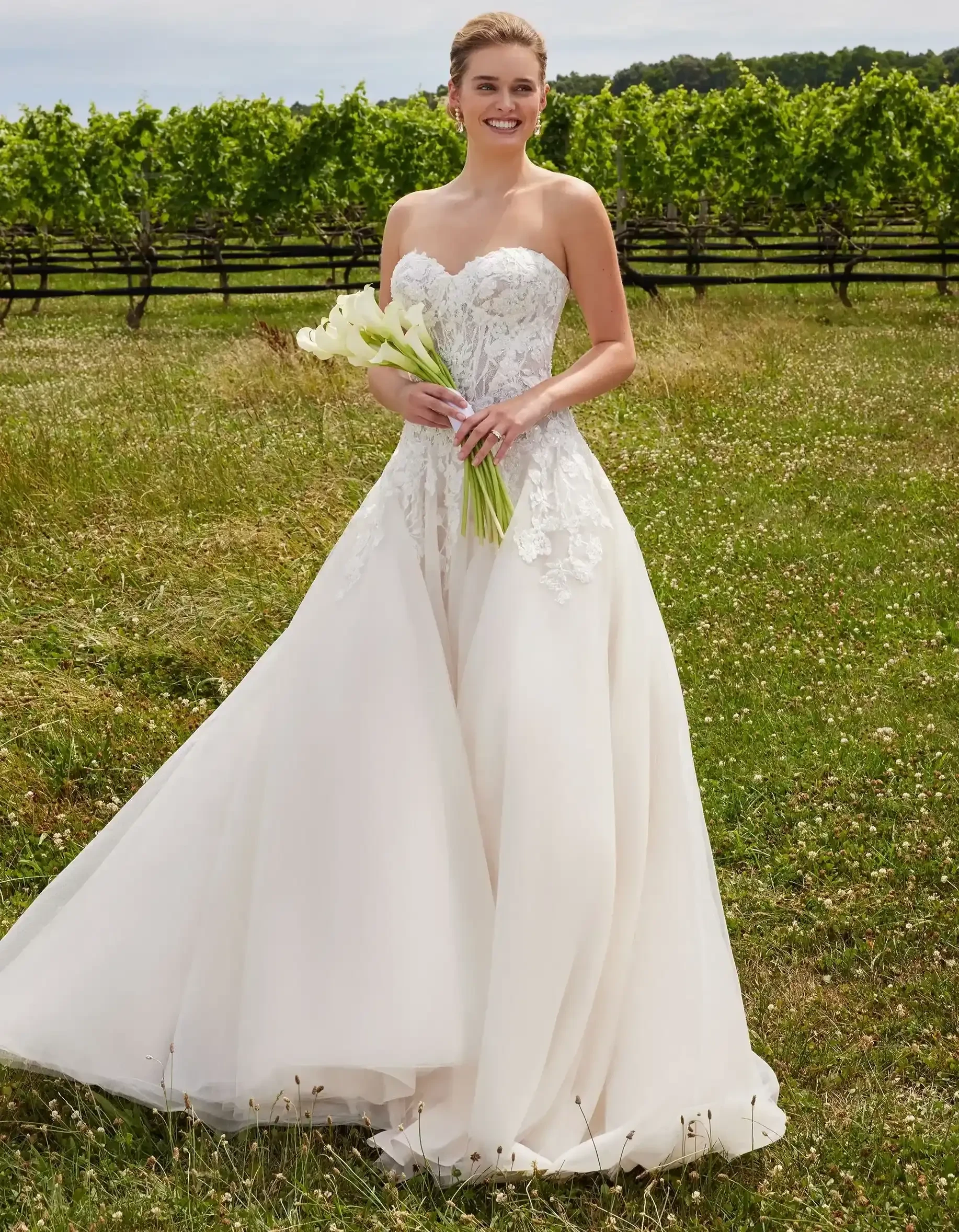 Model wearing a gown by Morilee